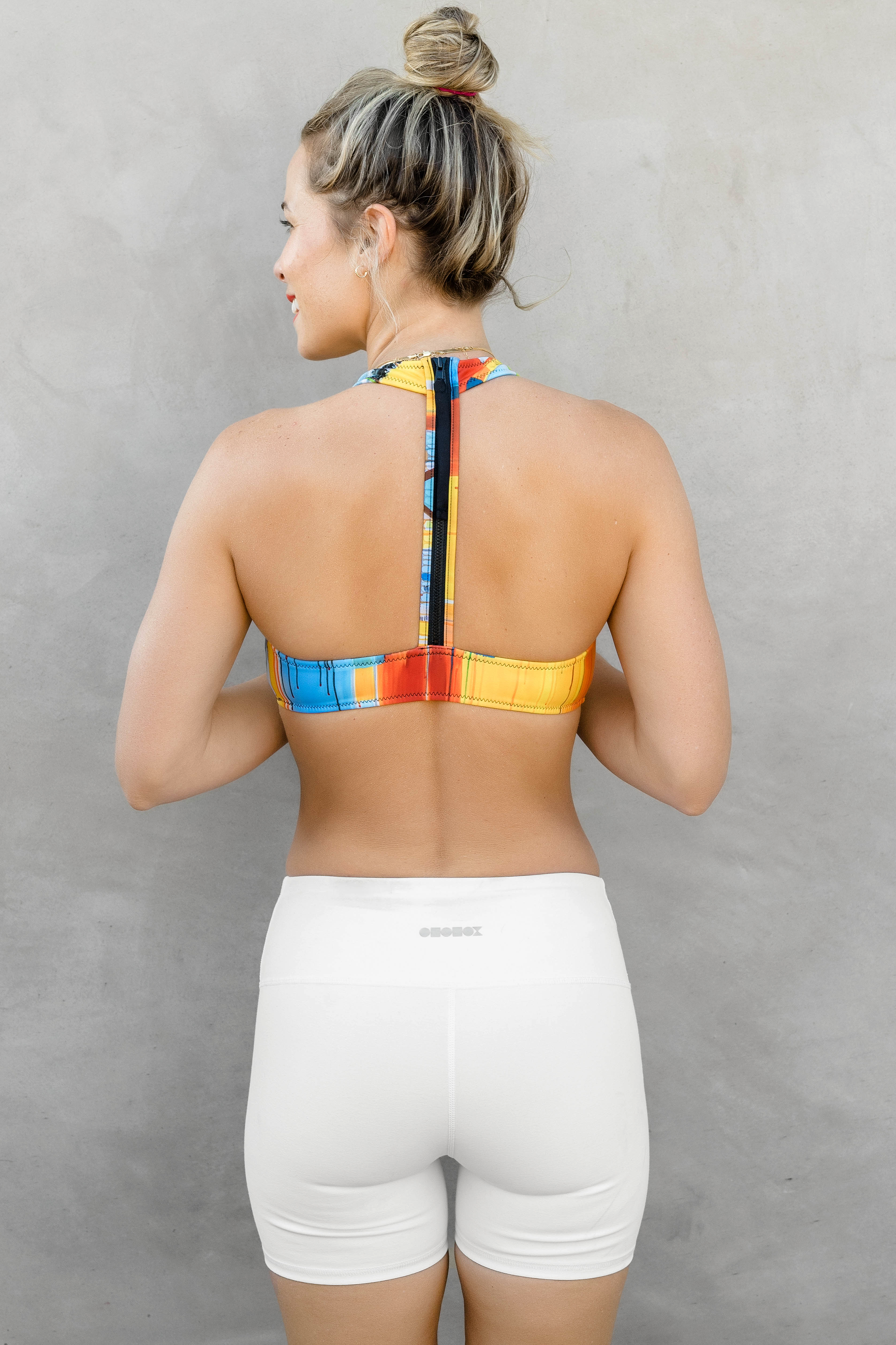 back of patterned halter top with black strap