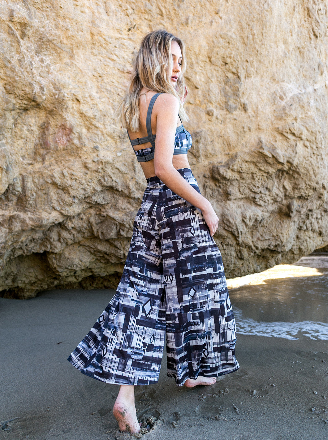 model wearing patterned wrap pant