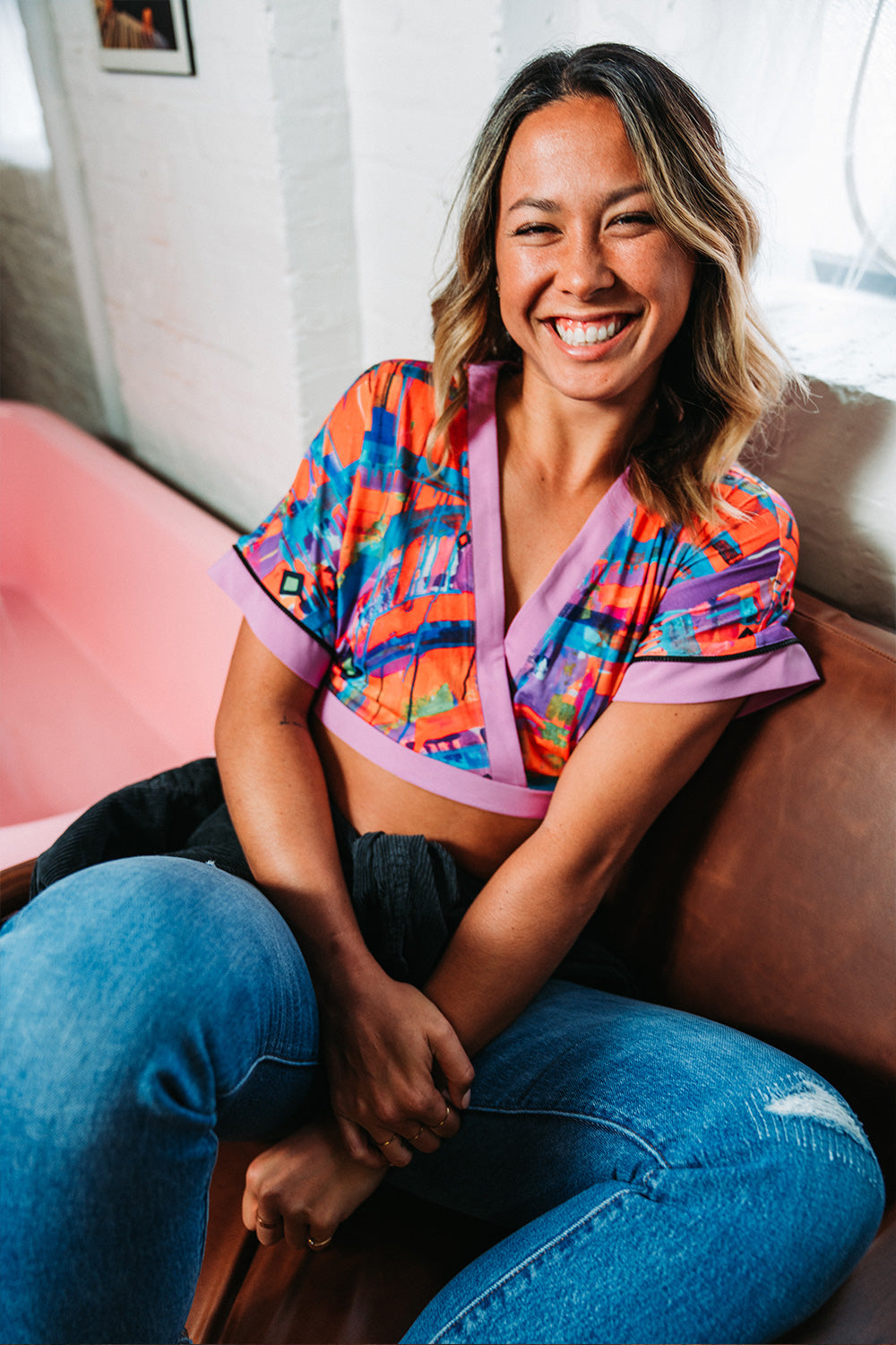 model wearing crop top blue jeans