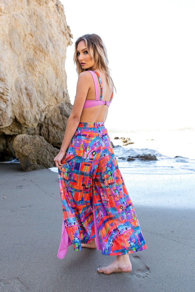 woman on beach patterned wrap pants
