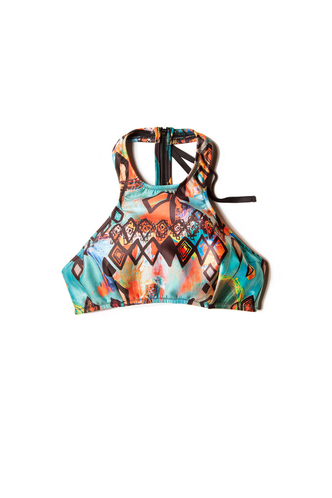 front of colorful patterned halter top